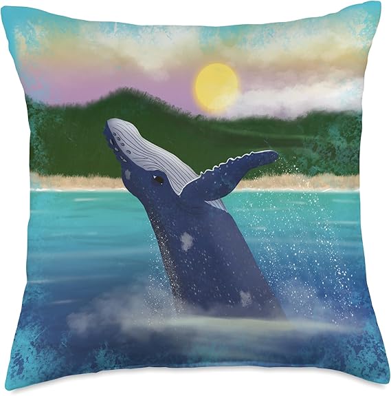 square pillow with a painting of a humpback whale breaching in the ocean in front of a beautiful island sunset